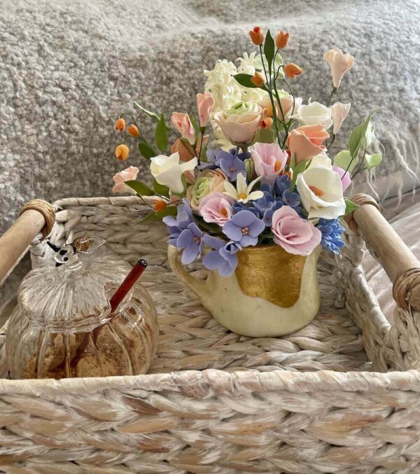 Pastel peachy ranunculus with blue flowers