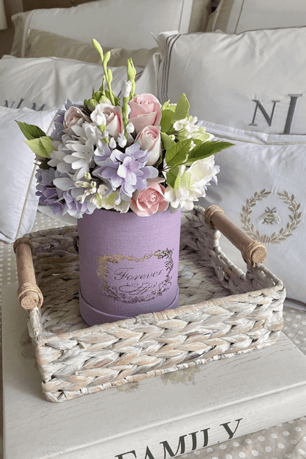 pastel flowers in round gift box