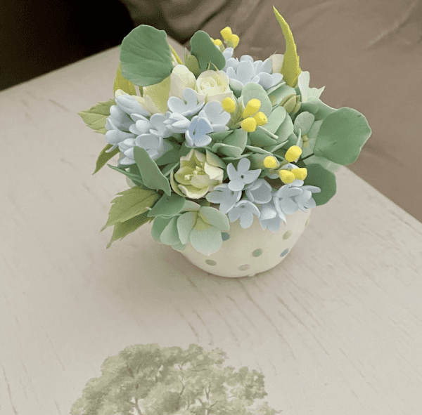 mini bouquet in clay polka dot pot