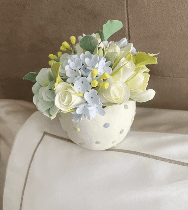 White roses in clay pot