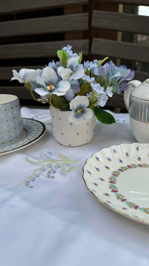 pastel blue pansies and small blue flowers